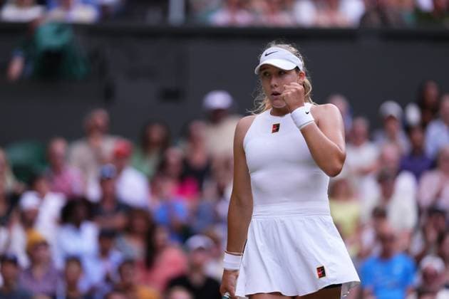 Russia s Mirra Andreeva reacts as she plays against Switzerland s Belinda Bencic during their women s singles quarter-final tennis match on the tenth day of the 2025 Wimbledon Championships at The All England Lawn Tennis and Croquet Club in Wimbledon, southwest London, on July 9, 2025.  Copyright: xx