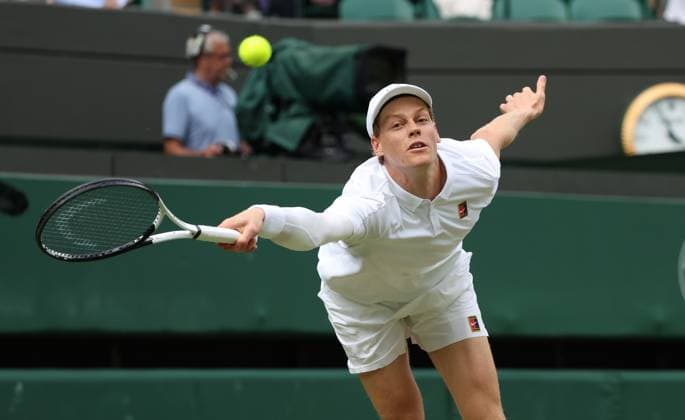 Italian Jannik Sinner plays a backhand in his Quarter-Final match against American Ben Shelton on day ten of the 2025 Wimbledon Championships in London on Wednesday, July 09, 2025.  LON2025070955 HUGOxPHILPOTT