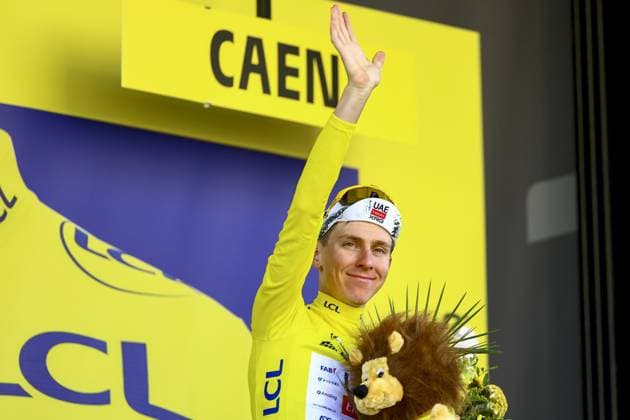 Slovenian Tadej Pogacar of UAE Team Emirates celebrates on the podium in the yellow jersey of leader in the overall ranking after stage five of the 2025 Tour de France cycling, a 33km time trial in Caen, France on Wednesday 09 July 2025. The 112th edition of the Tour de France starts on Saturday 5 July in Lille, France, and will finish in Paris, France on the 27th of July. DAVIDxPINTENS  x128773431x