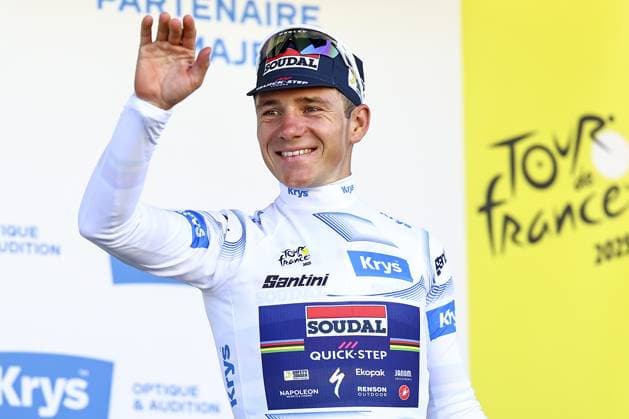 Belgian Remco Evenepoel of Soudal Quick-Step celebrates on the podium in the white jersey for best young rider after pictured in action during stage five of the 2025 Tour de France cycling, a 33km time trial in Caen, France on Wednesday 09 July 2025. The 112th edition of the Tour de France starts on Saturday 5 July in Lille, France, and will finish in Paris, France on the 27th of July. DAVIDxPINTENS  x128773551x