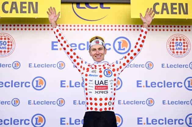 Slovenian Tadej Pogacar of UAE Team Emirates celebrates on the podium in the red polka-dot jersey for best climber after stage five of the 2025 Tour de France cycling, a 33km time trial in Caen, France on Wednesday 09 July 2025. The 112th edition of the Tour de France starts on Saturday 5 July in Lille, France, and will finish in Paris, France on the 27th of July. JASPERxJACOBS  x128773552x