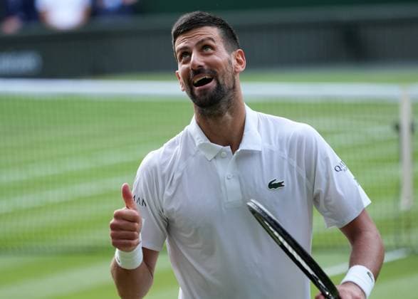 Tennis - 2025 Wimbledon Championships - Men™s singles- Quarter Final - Flavio Cobolli v Novak Djokovic All England Lawn Tennis & Croquet Club - Wednesday 9th July 2025 Novak Djokovic looks to the players box after losing his serve 