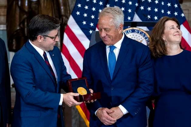 Speaker of the House Mike Johnson, R-LA, presents American cyclist Greg Lemond with the Congressional Medal of Honor during a ceremony in Statuary Hall at the U.S. Capitol in Washington, DC on Wednesday, July 9, 2025. Lemond, the first American to win the Tour de France, was awarded the medal in 2020 but the ceremony was delayed due to the COVID-19 pandemic.  WAP20250709312 BONNIExCASH