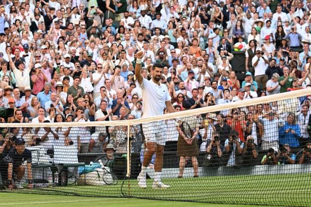(250710) -- LONDON, July 10, 2025 -- Novak Djokovic celebrates after the men s singles quarterfinal match between Novak Djokovic of Serbia and Flavio Cobolli of Italy at the Wimbledon Tennis Championships in London, Britain, July 9, 2025. ) (SP)BRITAIN-LONDON-TENNIS-WIMBLEDON-MEN S SINGLES ZhaoxDingzhe 