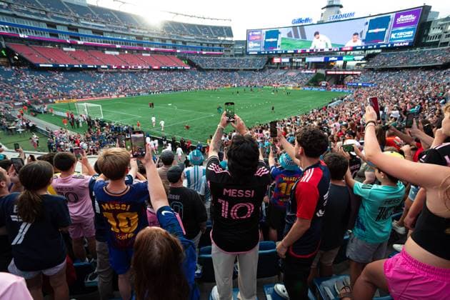 July 9, 2025; Foxborough, Massachusetts, USA; Fans capture the moment Inter Miami CF forward Lionel Messi (10) and teammates walk onto the field in a Major League Soccer game between the New England Revolution and Inter Miami CF at Gillette Stadium. (c) CSM - ZUMAc04_ 20250709_zma_c04_173 Copyright: xBurtxGranofskyx