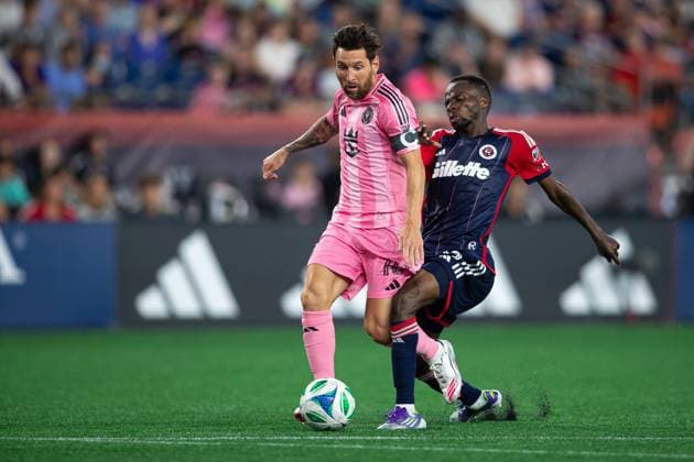 July 9, 2025; Foxborough, Massachusetts, USA; Inter Miami CF forward Lionel Messi (10) slides past New England Revolution midfielder Alhassan Yusuf (80) in a Major League Soccer game between the New England Revolution and Inter Miami CF at Gillette Stadium. (c) CSM - ZUMAc04_ 20250709_zma_c04_199 Copyright: xBurtxGranofskyx