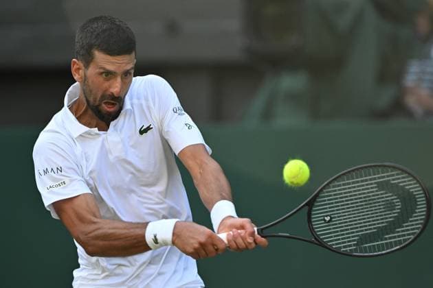 (250710) -- LONDON, July 10, 2025 -- Novak Djokovic hits a return during the men s singles quarterfinal match between Novak Djokovic of Serbia and Flavio Cobolli of Italy at the Wimbledon Tennis Championships in London, Britain, July 9, 2025. ) (SP)BRITAIN-LONDON-TENNIS-WIMBLEDON-MEN S SINGLES ZhaoxDingzhe 