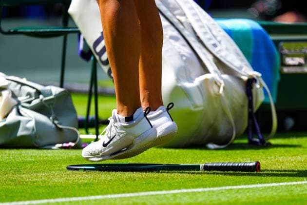 Aryna Sabalenka stands on her racket during her semi final match Wimbledon Tennis Championships, Day 11, The All England Lawn Tennis and Croquet Club, London, UK - 10 Jul 2025London The All England Lawn Tennis and United Kingdom  Copyright: xJavierxGarcia Shutterstockx 15390589cl