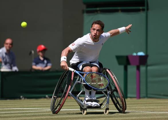 9th July 2025; All England Lawn Tennis and Croquet Club, London, England; Wimbledon Tennis Tournament, Day 10; Alfie Hewett (GBR) with a backhand shot to Zhenxu Ji (CHN) in their mens wheelchair singles quarter-final  ActionPlus12812003 JohnxPatrickxFletcher