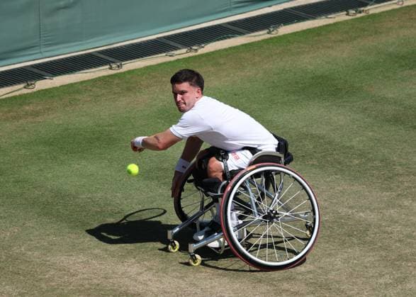 9th July 2025; All England Lawn Tennis and Croquet Club, London, England; Wimbledon Tennis Tournament, Day 10; Gordon Reid (GBR) with a backhand shot to Gustavo Fernandez (ARG) in their mens wheelchair singles quarter-final  ActionPlus12812025 JohnxPatrickxFletcher