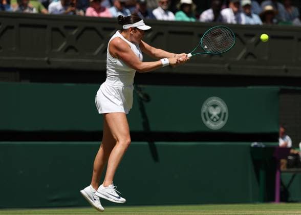 9th July 2025; All England Lawn Tennis and Croquet Club, London, England; Wimbledon Tennis Tournament, Day 10; Amanda Anisimova (USA) with a backhand shot to Aryna Sabalenka (BLR) during their Ladies Singles Semi Final  ActionPlus12812046 JohnxPatrickxFletcher