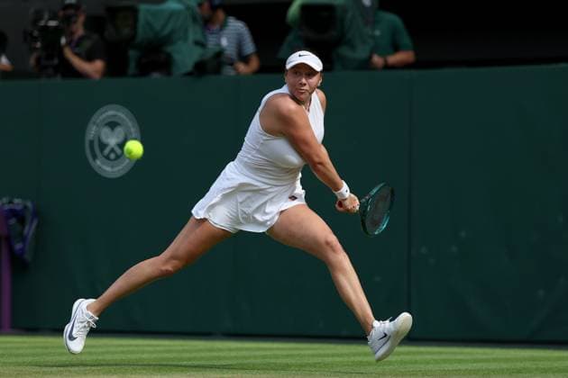 9th July 2025; All England Lawn Tennis and Croquet Club, London, England; Wimbledon Tennis Tournament, Day 10; Amanda Anisimova (USA) with a backhand shot to Aryna Sabalenka (BLR) in their womens singles semi-fina  ActionPlus12812117 JohnxPatrickxFletcher