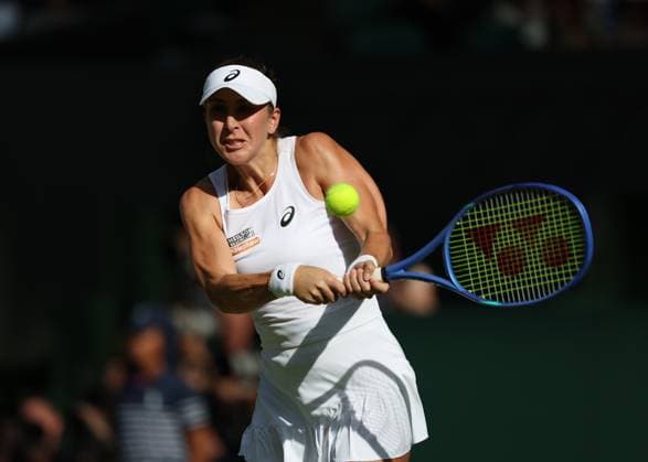 10th July 2025; All England Lawn Tennis and Croquet Club, London, England; Wimbledon Tennis Tournament, Day 11; Iga Swiatek (POL) with a backhand shot to Belinda Bencic (SUI) , during their womens singles semi-final match  ActionPlus12812171 JohnxPatrickxFletcher