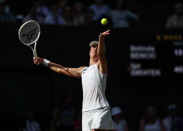 10th July 2025; All England Lawn Tennis and Croquet Club, London, England; Wimbledon Tennis Tournament, Day 11; Iga Swiatek (POL) serves to Belinda Bencic (SUI) , during their womens singles semi-final match  ActionPlus12812168 JohnxPatrickxFletcher