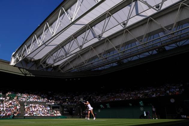 10th July 2025; All England Lawn Tennis and Croquet Club, London, England; Wimbledon Tennis Tournament, Day 11; A packed Centre Court as Iga Swiatek (POL) hits a backhand shot to Belinda Bencic (SUI) in their ladies singles semi-final  ActionPlus12812233 JohnxPatrickxFletcher