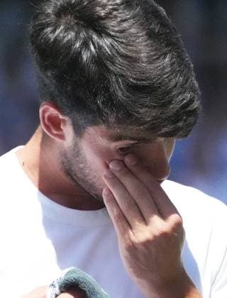 Tennis - 2025 Wimbledon Championships - Mens Semi Final - Taylor Fritz v Carlos Alcaraz All England Lawn Tennis & Croquet Club - Friday 11th July 2025 Carlos Alcaraz of Spain gets something in his eye 