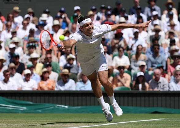 11th July 2025; All England Lawn Tennis and Croquet Club, London, England; Wimbledon Tennis Tournament, Day 12; Taylor Fritz (USA) reaches for a forehand shot to Carlos Alcaraz (ESP) mens singles semi-final  ActionPlus12812290 JohnxPatrickxFletcher