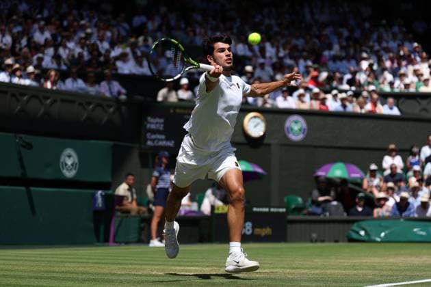 11th July 2025; All England Lawn Tennis and Croquet Club, London, England; Wimbledon Tennis Tournament, Day 12; Carlos Alcaraz (ESP) with a forehand shot to Taylor Fritz (USA) mens singles semi-final  ActionPlus12812307 JohnxPatrickxFletcher