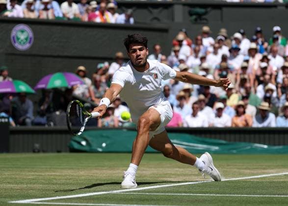 11th July 2025; All England Lawn Tennis and Croquet Club, London, England; Wimbledon Tennis Tournament, Day 12; Carlos Alcaraz (ESP) with a forehand shot to Taylor Fritz (USA) mens singles semi-final  ActionPlus12812295 JohnxPatrickxFletcher