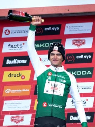 CYCLING - Tour of Austria 2025 SALZBURG,AUSTRIA,11.JUL.25 - CYCLING - Tour of Austria, stage 3, Salzburg - Salzburg. Image shows the rejoicing of Isaac Del Toro (MEX - UAE TEAM EMIRATES XRG). keywords: award ceremony.  GEPAxpictures xJulioxArrelano