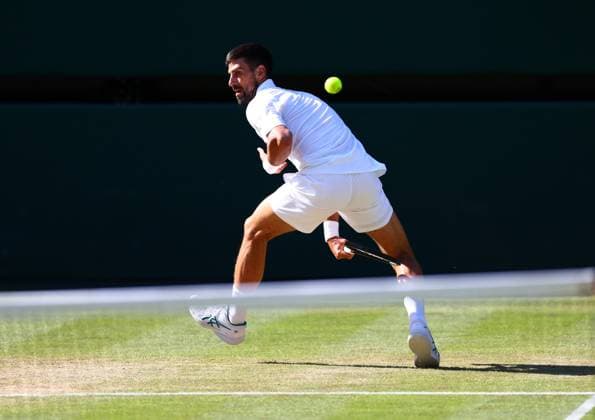 Novak Djokovic hits the ball between his legs during his semi final match Wimbledon Tennis Championships, Day 12, The All England Lawn Tennis and Croquet Club, London, UK - 11 Jul 2025London The All England Lawn Tennis and United Kingdom  Copyright: xJamesxMarsh Shutterstockx 15392288eg