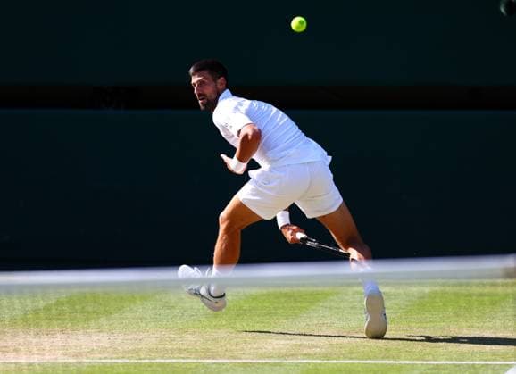 Novak Djokovic hits the ball between his legs during his semi final match Wimbledon Tennis Championships, Day 12, The All England Lawn Tennis and Croquet Club, London, UK - 11 Jul 2025London The All England Lawn Tennis and United Kingdom  Copyright: xJamesxMarsh Shutterstockx 15392288el