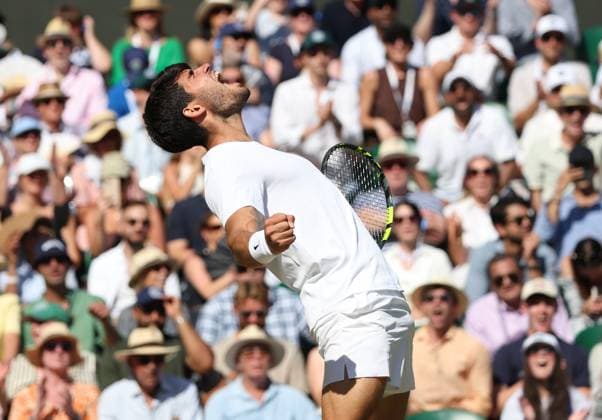 Spain s Carlos Alcaraz celebrates victory over American Taylor Fritz in his Men s Semi-Final match on day twelve of the 2025 Wimbledon Championships in London on Friday, July 11, 2025.  LON2025071101 HUGOxPHILPOTT