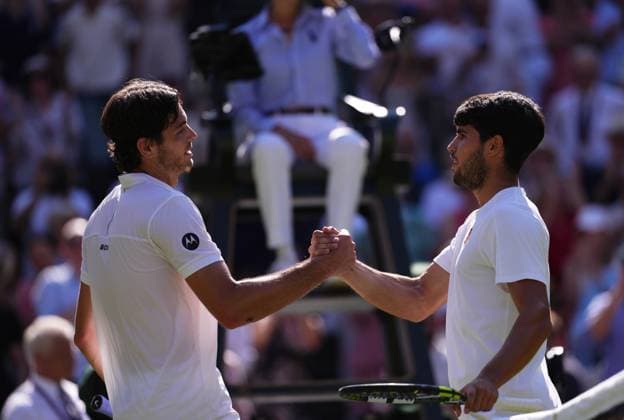 Taylor Fritz of the United States of America (left) and Carlos Alcaraz of Spain shake hands after the Men s Singles Semifinal match on day twelve of The Championships Wimbledon 2025 at All England Lawn Tennis and Croquet Club on July 11, 2025 in London, England.  Copyright: xHiroshixSatox