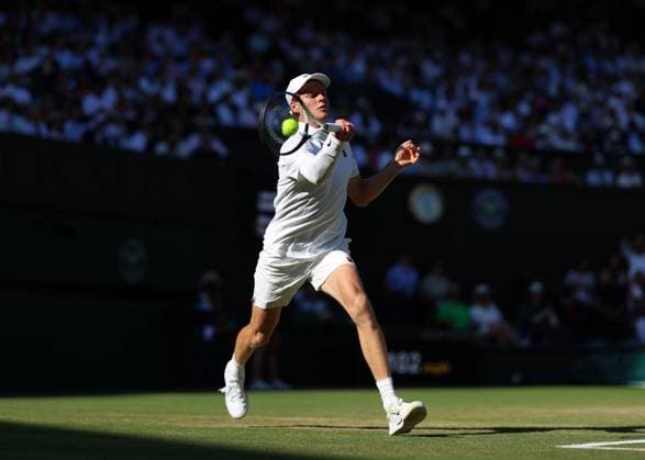 11th July 2025; All England Lawn Tennis and Croquet Club, London, England; Wimbledon Tennis Tournament, Day 12; Jannik Sinner (ITA) with a forehand shot to Novak Djokovic (SRB) mens singles semi-final  ActionPlus12812427 JohnxPatrickxFletcher