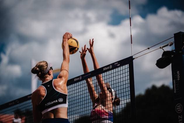 Beach volleyball women Allianz German Beach Tour 2025 Tourstop Munich 11 07 2025 f l Marie Schieder attacking Sarah Schulz Munich Central University Sports Munich Bavaria Germany