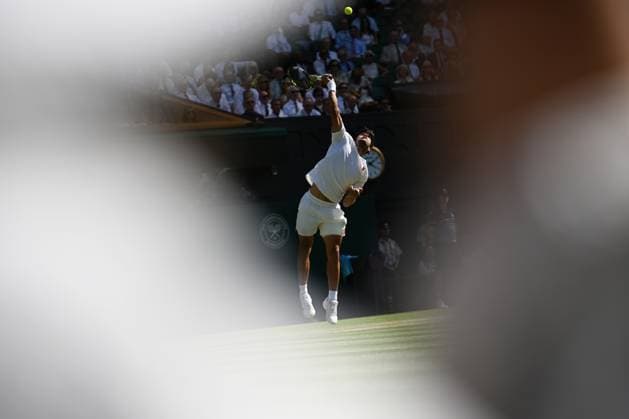 (250712) -- LONDON, July 12, 2025 -- Carlos Alcaraz serves during the men s singles semifinal match between Carlos Alcaraz of Spain and Taylor Fritz of the United States at the Wimbledon Tennis Championships in London, Britain, July 11, 2025. ) (SP)BRITAIN-LONDON-TENNIS-WIMBLEDON-MEN S SINGLES ZhaoxDingzhe 