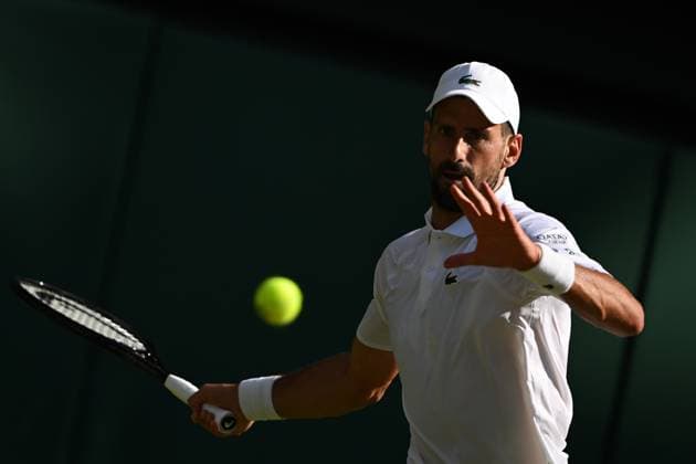(250712) -- LONDON, July 12, 2025 -- Novak Djokovic hits a return during the men s singles semifinal match between Jannik Sinner of Italy and Novak Djokovic of Serbia at the Wimbledon Tennis Championships in London, Britain, July 11, 2025. ) (SP)BRITAIN-LONDON-TENNIS-WIMBLEDON-MEN S SINGLES ZhaoxDingzhe 