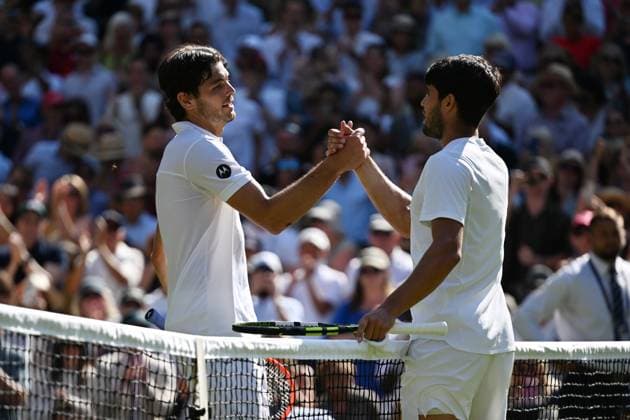 (250712) -- LONDON, July 12, 2025 -- Carlos Alcaraz (R) greets Taylor Fritz after the men s singles semifinal match between Carlos Alcaraz of Spain and Taylor Fritz of the United States at the Wimbledon Tennis Championships in London, Britain, July 11, 2025. ) (SP)BRITAIN-LONDON-TENNIS-WIMBLEDON-MEN S SINGLES ZhaoxDingzhe 