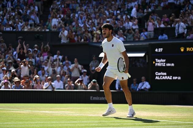 (250712) -- LONDON, July 12, 2025 -- Carlos Alcaraz celebrates winning the men s singles semifinal match between Carlos Alcaraz of Spain and Taylor Fritz of the United States at the Wimbledon Tennis Championships in London, Britain, July 11, 2025. ) (SP)BRITAIN-LONDON-TENNIS-WIMBLEDON-MEN S SINGLES ZhaoxDingzhe 