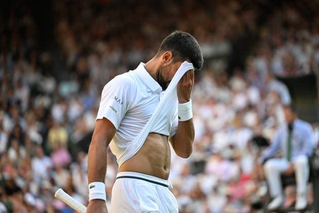 (250712) -- LONDON, July 12, 2025 -- Novak Djokovic reacts during the men s singles semifinal match between Jannik Sinner of Italy and Novak Djokovic of Serbia at the Wimbledon Tennis Championships in London, Britain, July 11, 2025. ) (SP)BRITAIN-LONDON-TENNIS-WIMBLEDON-MEN S SINGLES ZhaoxDingzhe 