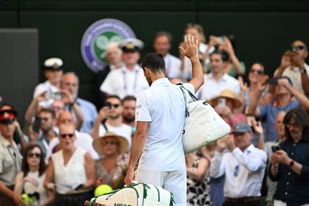 (250712) -- LONDON, July 12, 2025 -- Novak Djokovic leaves the court after the men s singles semifinal match between Jannik Sinner of Italy and Novak Djokovic of Serbia at the Wimbledon Tennis Championships in London, Britain, July 11, 2025. ) (SP)BRITAIN-LONDON-TENNIS-WIMBLEDON-MEN S SINGLES ZhaoxDingzhe 