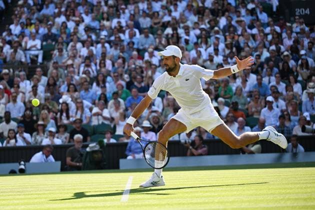 (250712) -- LONDON, July 12, 2025 -- Novak Djokovic hits a return during the men s singles semifinal match between Jannik Sinner of Italy and Novak Djokovic of Serbia at the Wimbledon Tennis Championships in London, Britain, July 11, 2025. ) (SP)BRITAIN-LONDON-TENNIS-WIMBLEDON-MEN S SINGLES ZhaoxDingzhe 
