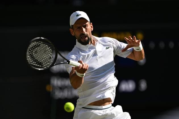 (250712) -- LONDON, July 12, 2025 -- Novak Djokovic hits a return during the men s singles semifinal match between Jannik Sinner of Italy and Novak Djokovic of Serbia at the Wimbledon Tennis Championships in London, Britain, July 11, 2025. ) (SP)BRITAIN-LONDON-TENNIS-WIMBLEDON-MEN S SINGLES ZhaoxDingzhe 