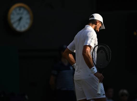 (250712) -- LONDON, July 12, 2025 -- Novak Djokovic reacts during the men s singles semifinal match between Jannik Sinner of Italy and Novak Djokovic of Serbia at the Wimbledon Tennis Championships in London, Britain, July 11, 2025. ) (SP)BRITAIN-LONDON-TENNIS-WIMBLEDON-MEN S SINGLES ZhaoxDingzhe 