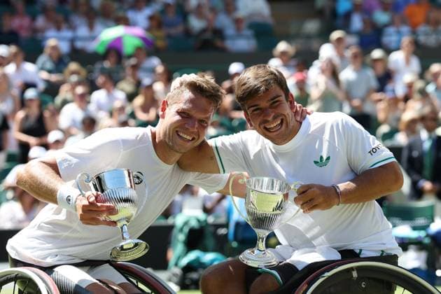 12th July 2025; All England Lawn Tennis and Croquet Club, London, England; Wimbledon Tennis Tournament, Day 13; Martin De La Puente (ESP) and Ruben Spaargaren (NED) pose with the Gentlemen& x2019;s Wheelchair trophy after defeating Alfie Hewett (GBR) and Gordon Reid (GBR) on Court Number One in their men s wheelchair doubles final  ActionPlus12812525 JohnxPatrickxFletcher
