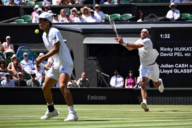 (250712) -- LONDON, July 12, 2025 -- Rinky Hijikata David Pel (R) compete during the men s doubles final between Rinky Hijikata (Australia) David Pel (the Netherlands) and Julian Cash Lloyd Glasspool of Britain at the Wimbledon Tennis Championships in London, Britain, July 12, 2025. ) (SP)BRITAIN-LONDON-TENNIS-WIMBLEDON-MEN S DOUBLES-FINAL ZhaoxDingzhe 