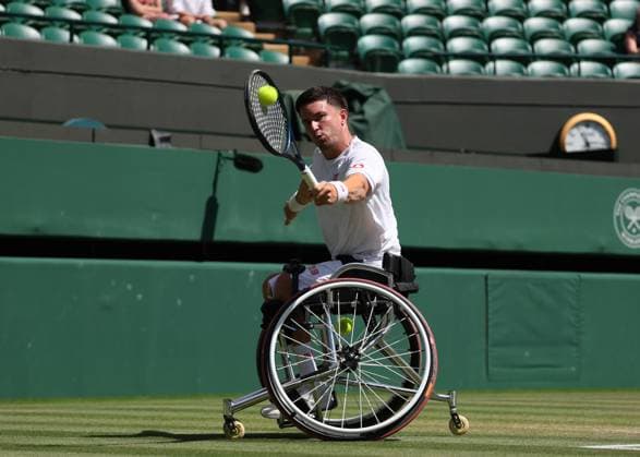 12th July 2025; All England Lawn Tennis and Croquet Club, London, England; Wimbledon Tennis Tournament, Day 13; Gordon Reid (GBR) with a backhand shot to Ruben Spaargaren (NED) in their men s wheelchair doubles final  ActionPlus12812503 JohnxPatrickxFletcher