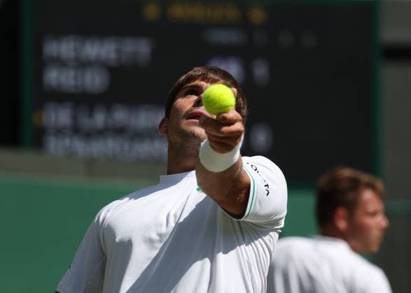 12th July 2025; All England Lawn Tennis and Croquet Club, London, England; Wimbledon Tennis Tournament, Day 13; Martin De La Puente (ESP) serves to Gordon Reid (GBR) in their men s wheelchair doubles final  ActionPlus12812510 JohnxPatrickxFletcher
