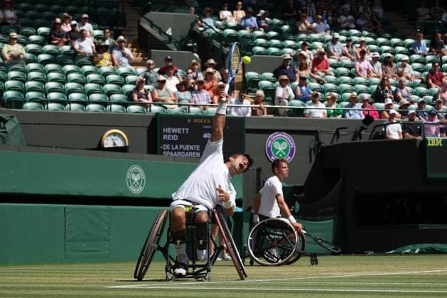 12th July 2025; All England Lawn Tennis and Croquet Club, London, England; Wimbledon Tennis Tournament, Day 13; Martin De La Puente (ESP) serves to Gordon Reid (GBR) in their men s wheelchair doubles final  ActionPlus12812515 JohnxPatrickxFletcher