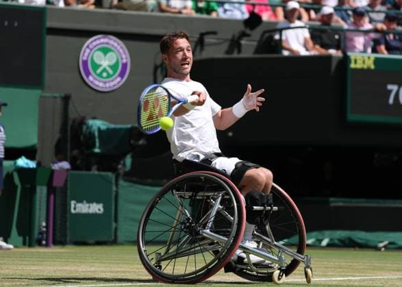 12th July 2025; All England Lawn Tennis and Croquet Club, London, England; Wimbledon Tennis Tournament, Day 13; Alfie Hewett (GBR) with a forehand shot to Martin De La Puente (ESP) in their men s wheelchair doubles final  ActionPlus12812517 JohnxPatrickxFletcher