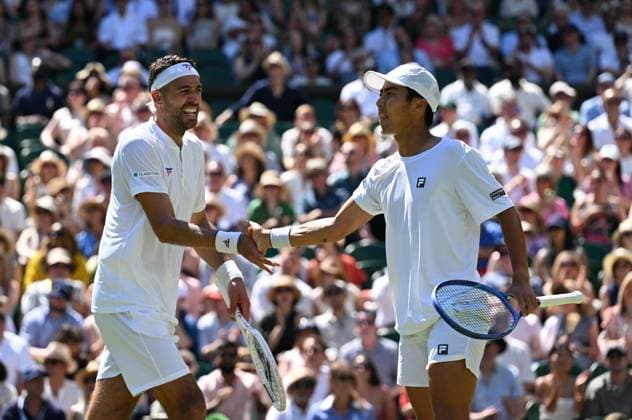 (250712) -- LONDON, July 12, 2025 -- Rinky Hijikata David Pel (L) react during the men s doubles final between Rinky Hijikata (Australia) David Pel (the Netherlands) and Julian Cash Lloyd Glasspool of Britain at the Wimbledon Tennis Championships in London, Britain, July 12, 2025. ) (SP)BRITAIN-LONDON-TENNIS-WIMBLEDON-MEN S DOUBLES-FINAL ZhaoxDingzhe 