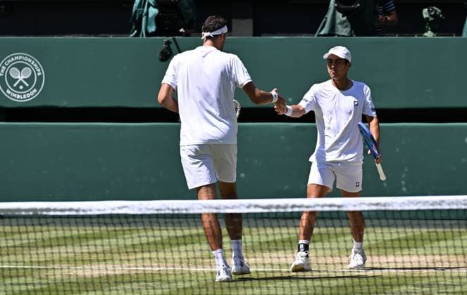 (250712) -- LONDON, July 12, 2025 -- Rinky Hijikata David Pel (L) react during the men s doubles final between Rinky Hijikata (Australia) David Pel (the Netherlands) and Julian Cash Lloyd Glasspool of Britain at the Wimbledon Tennis Championships in London, Britain, July 12, 2025. ) (SP)BRITAIN-LONDON-TENNIS-WIMBLEDON-MEN S DOUBLES-FINAL ZhaoxDingzhe 