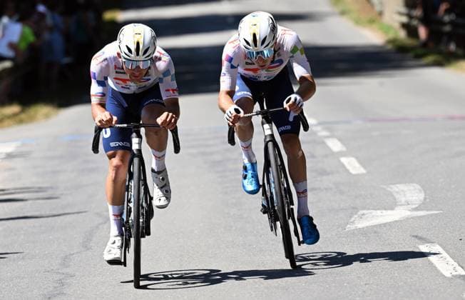 French Matteo Vercher of TotalEnergies and French Mathieu Burgaudeau of TotalEnergies pictured in action during stage eight of the 2025 Tour de France cycling, from Saint-Meen-le-Grand to Laval Espace Mayenne (174 km), on Saturday 12 July 2025 in France. The 112th edition of the Tour de France starts on Saturday 5 July in Lille, France, and will finish in Paris, France on the 27th of July. POOLxxPOOLxPETExGODING  x128975014x
