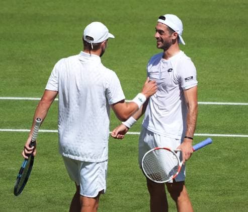 Tennis - 2025 Wimbledon Championships - Mens Doubles Final - Winky Hijikata and David Pel v Julian Cash and Lloyd Glasspool All England Lawn Tennis & Croquet Club - Saturday 12th July 2025 Julian Cash and Lloyd Glasspool celebrate winning match point 