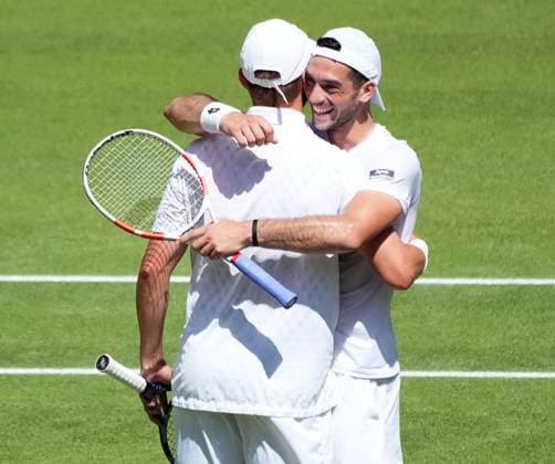 Tennis - 2025 Wimbledon Championships - Mens Doubles Final - Winky Hijikata and David Pel v Julian Cash and Lloyd Glasspool All England Lawn Tennis & Croquet Club - Saturday 12th July 2025 Julian Cash and Lloyd Glasspool celebrate winning match point 